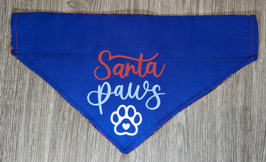 NOW HALF PRICE ! All 2023 Christmas designs now half price! ! Small Reversible Dog Bandana, Double sided - Santa Paws on blue background one side; paws, hearts & bone designs on red tartan on the other side.